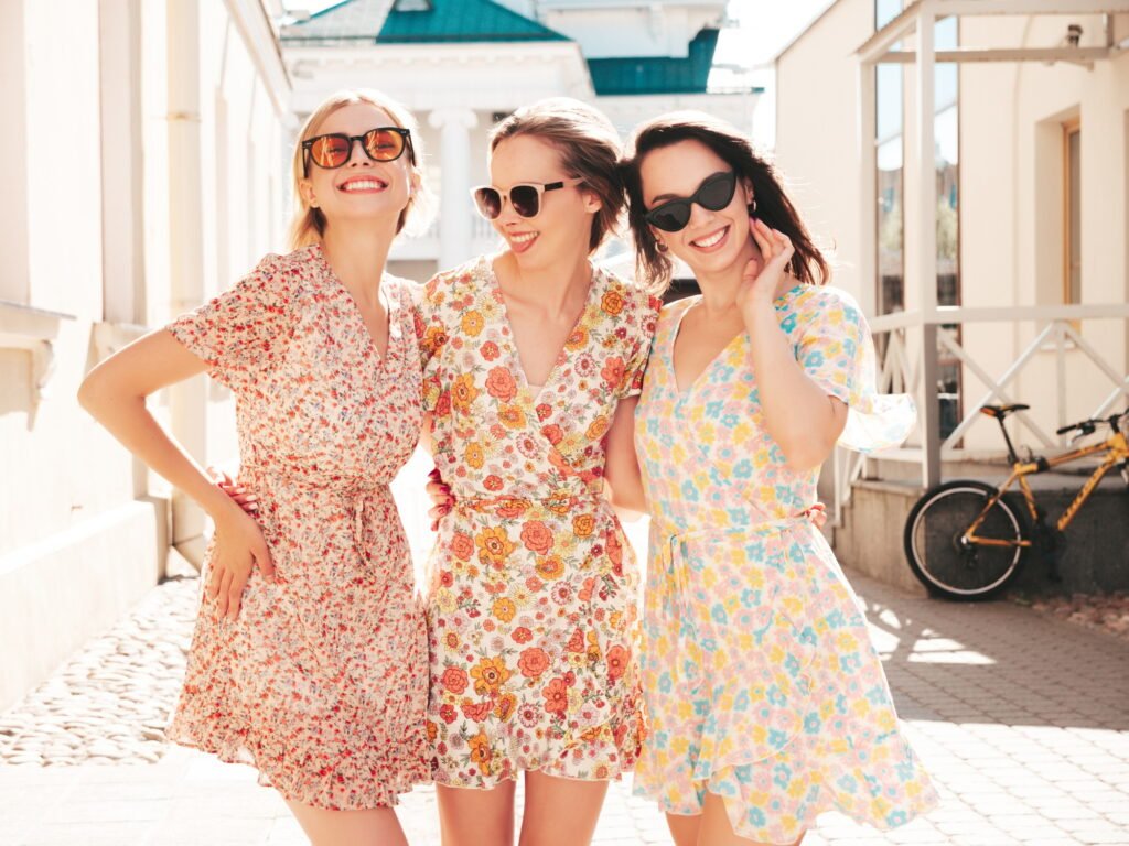 Three beautiful women posing outdoors